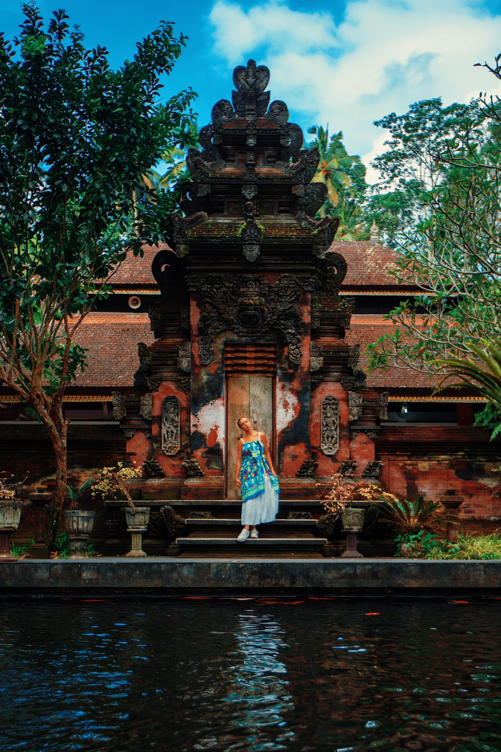 Marla standing in front of the temple with her head tiltied